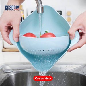 Two-piece light green plastic kitchen set with a perforated colander strainer nested inside a matching larger basin/bowl.